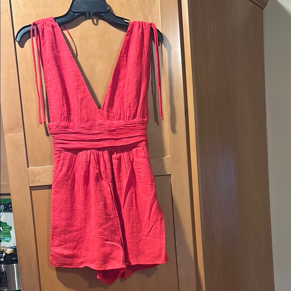 One Clothing Coral Deep V-Neck Jumpsuit. A gorgeous color! Great for summer!